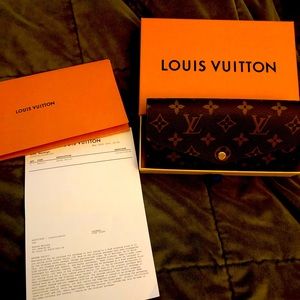 Authentic louis vuitton sarah wallet.  Like new condition.  Purchased last month
